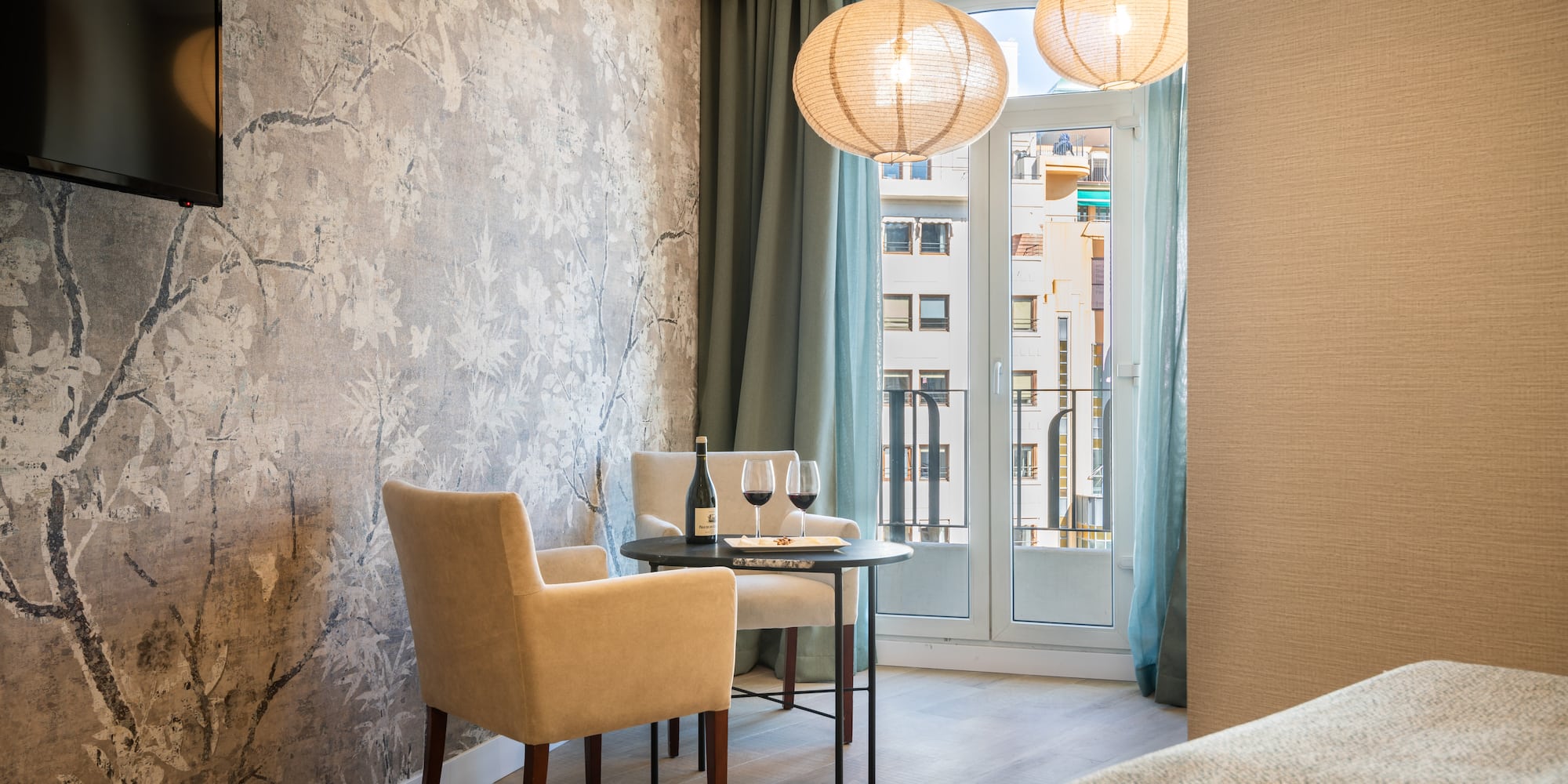 a room with a table and chairs and a table and a glass door