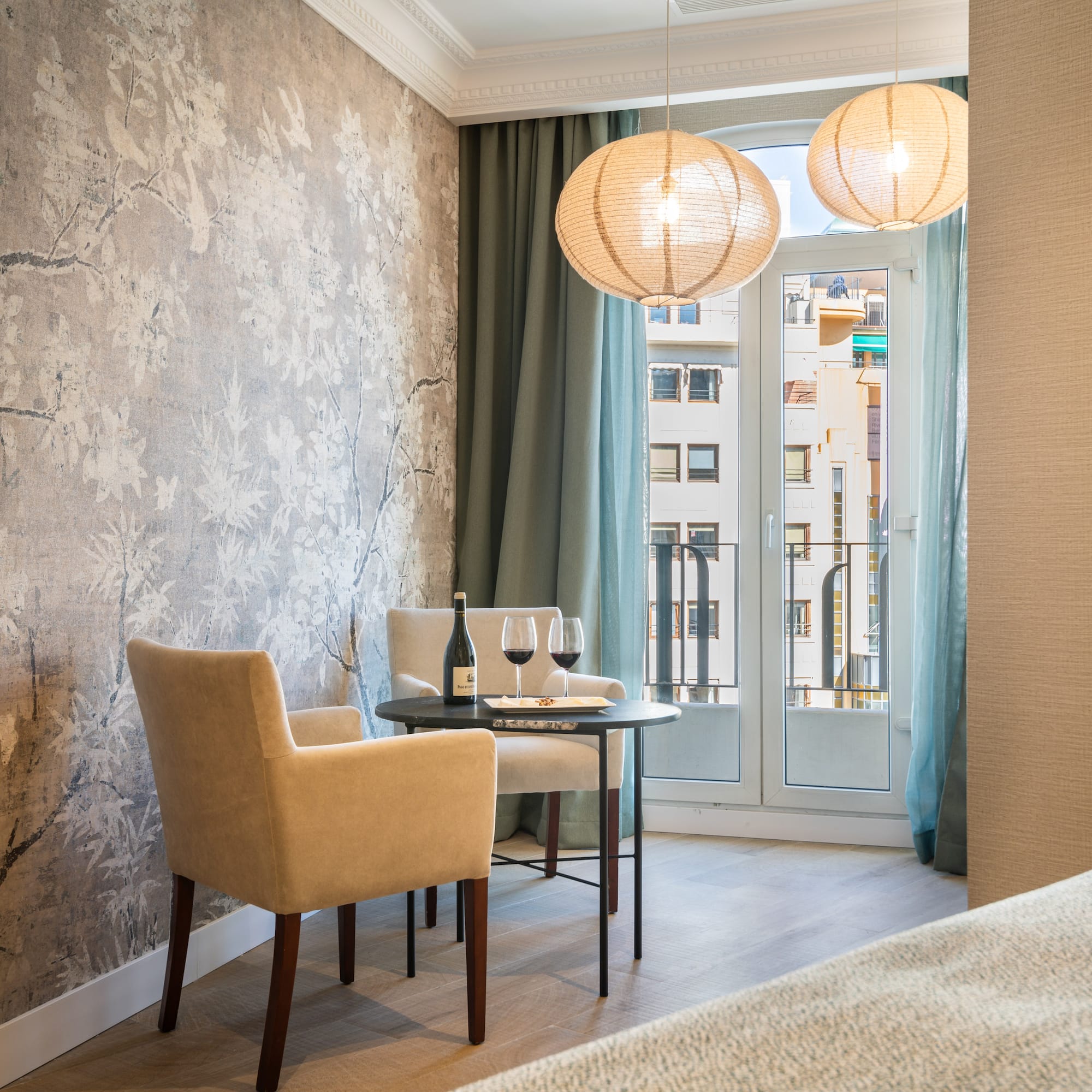 a room with a table and chairs and a table and a glass door