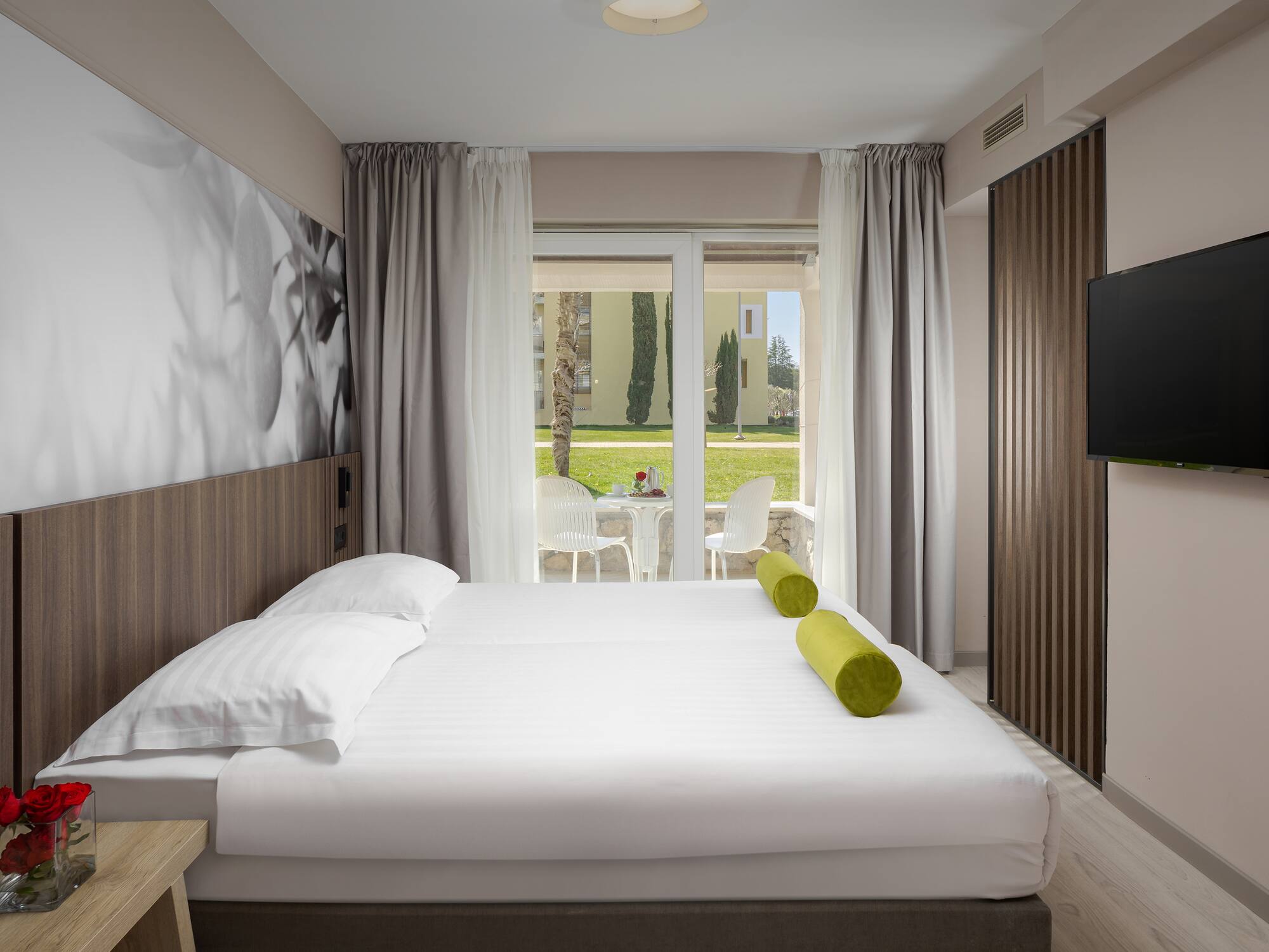 a bed with a television in a room