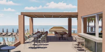 a patio with tables and chairs and a large umbrella