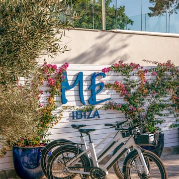 a bicycle parked in front of a sign