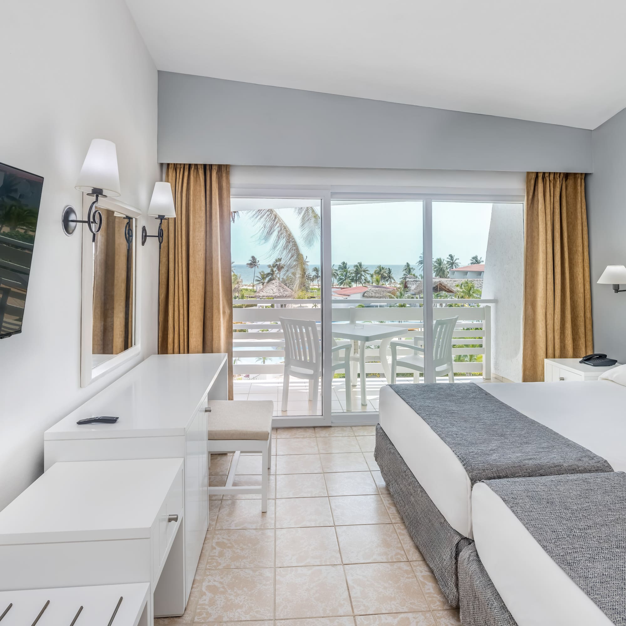 a room with a large bed and a television