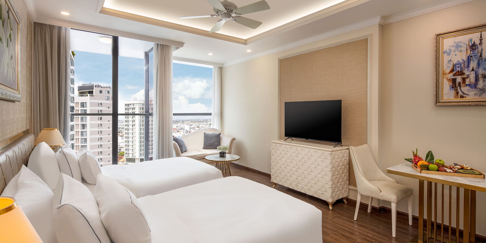 a room with two beds and a television