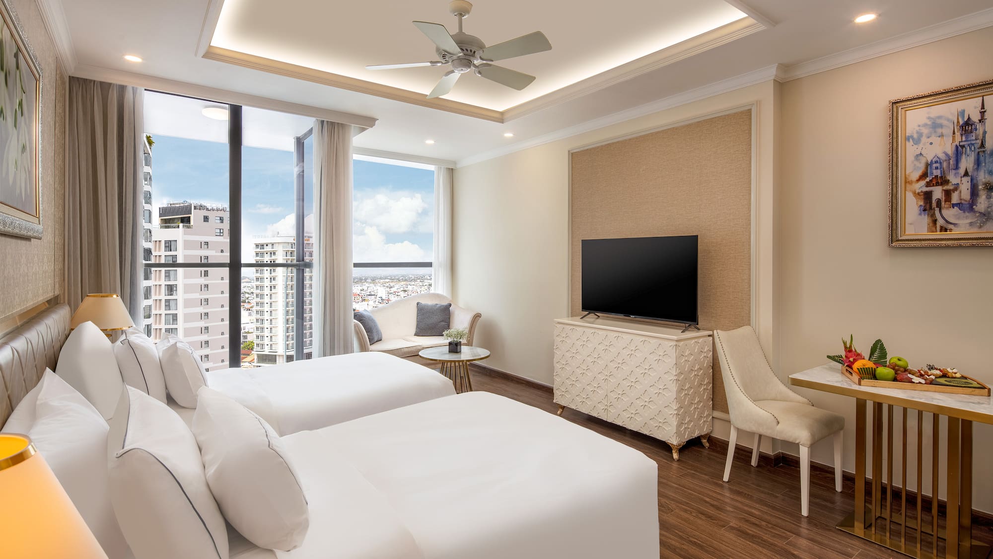 a room with two beds and a television