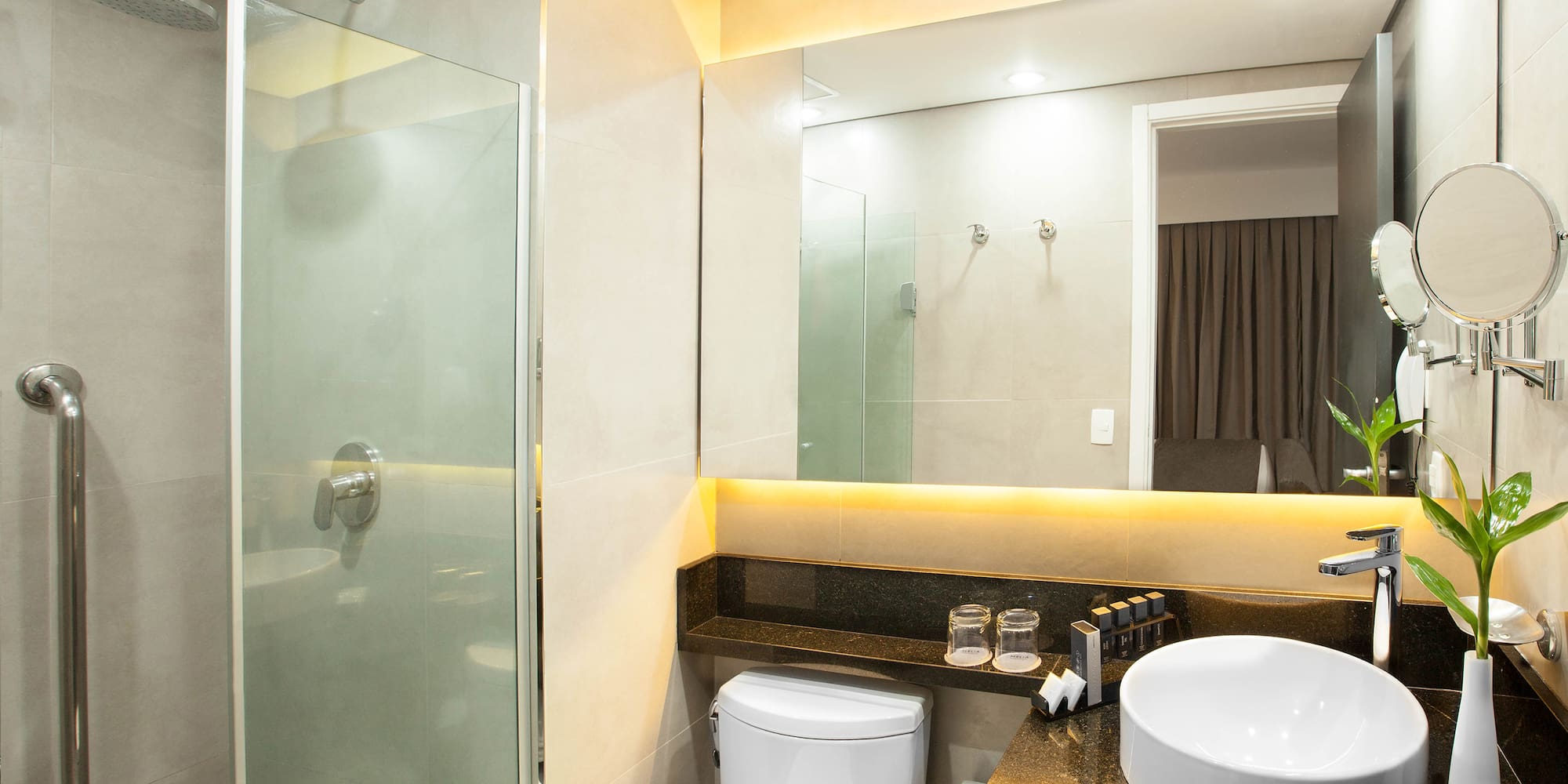 a bathroom with a sink and shower