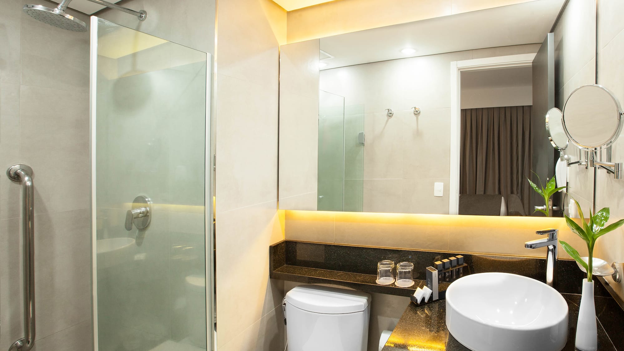 a bathroom with a sink and shower