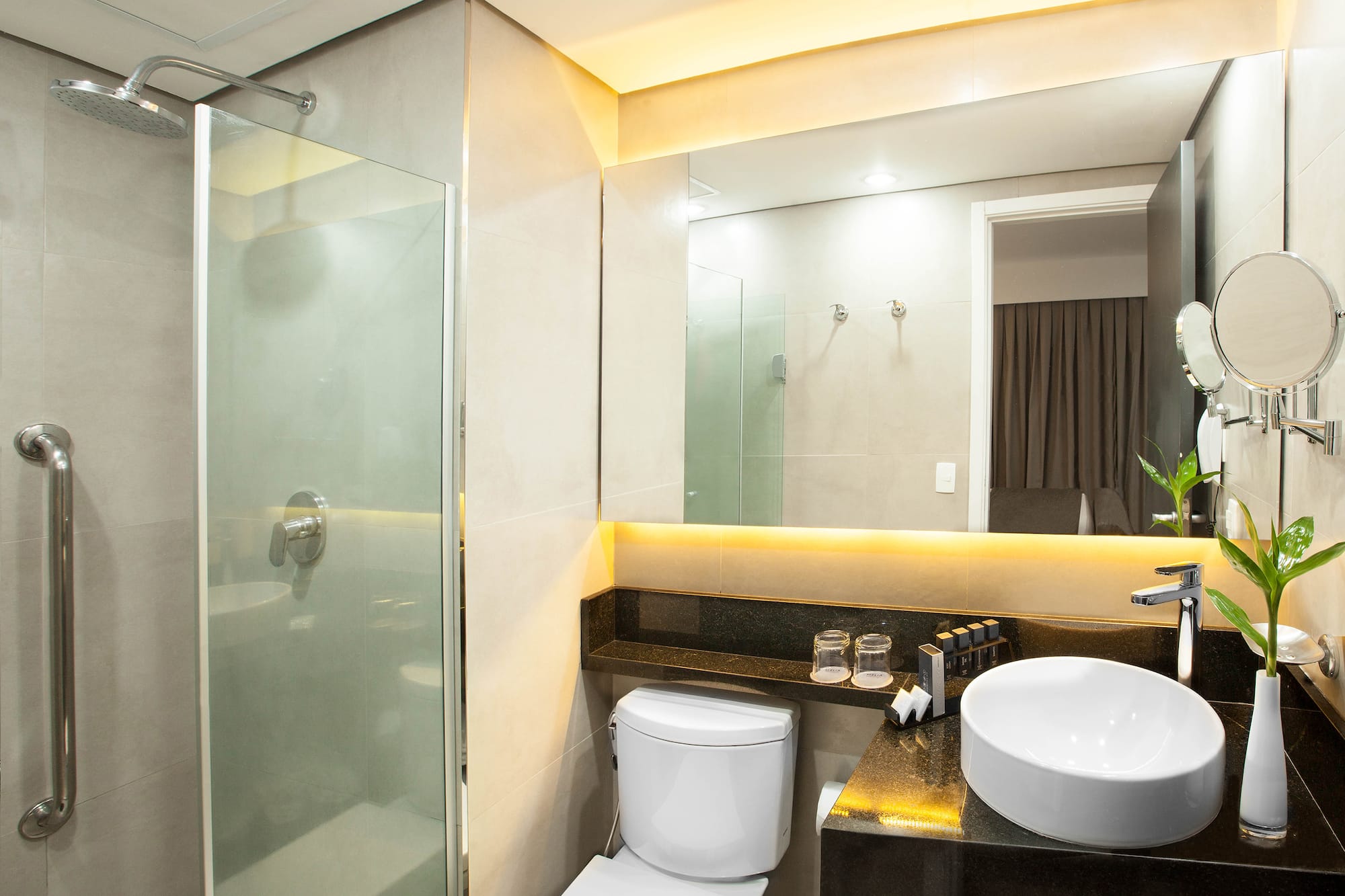 a bathroom with a sink and shower