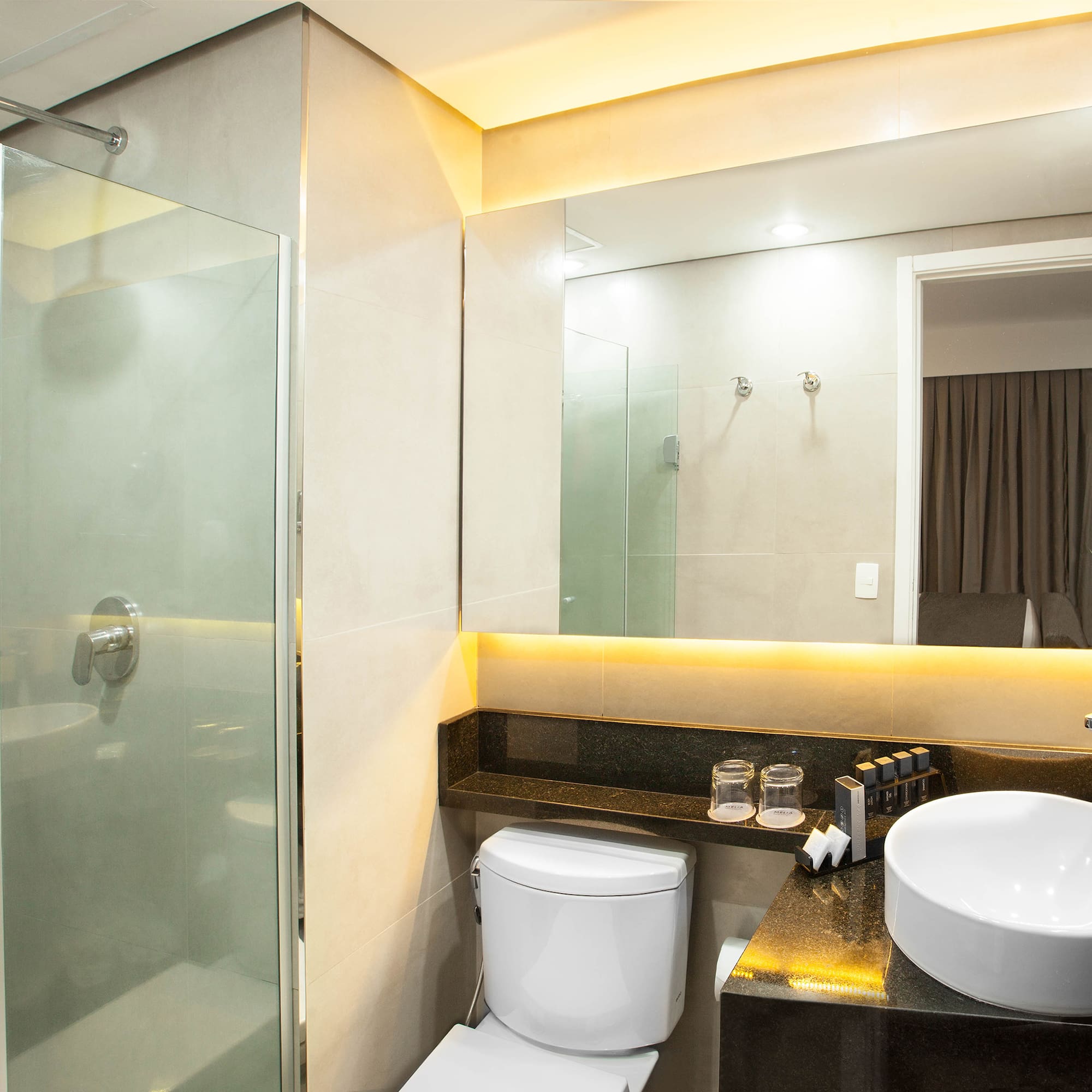 a bathroom with a sink and shower