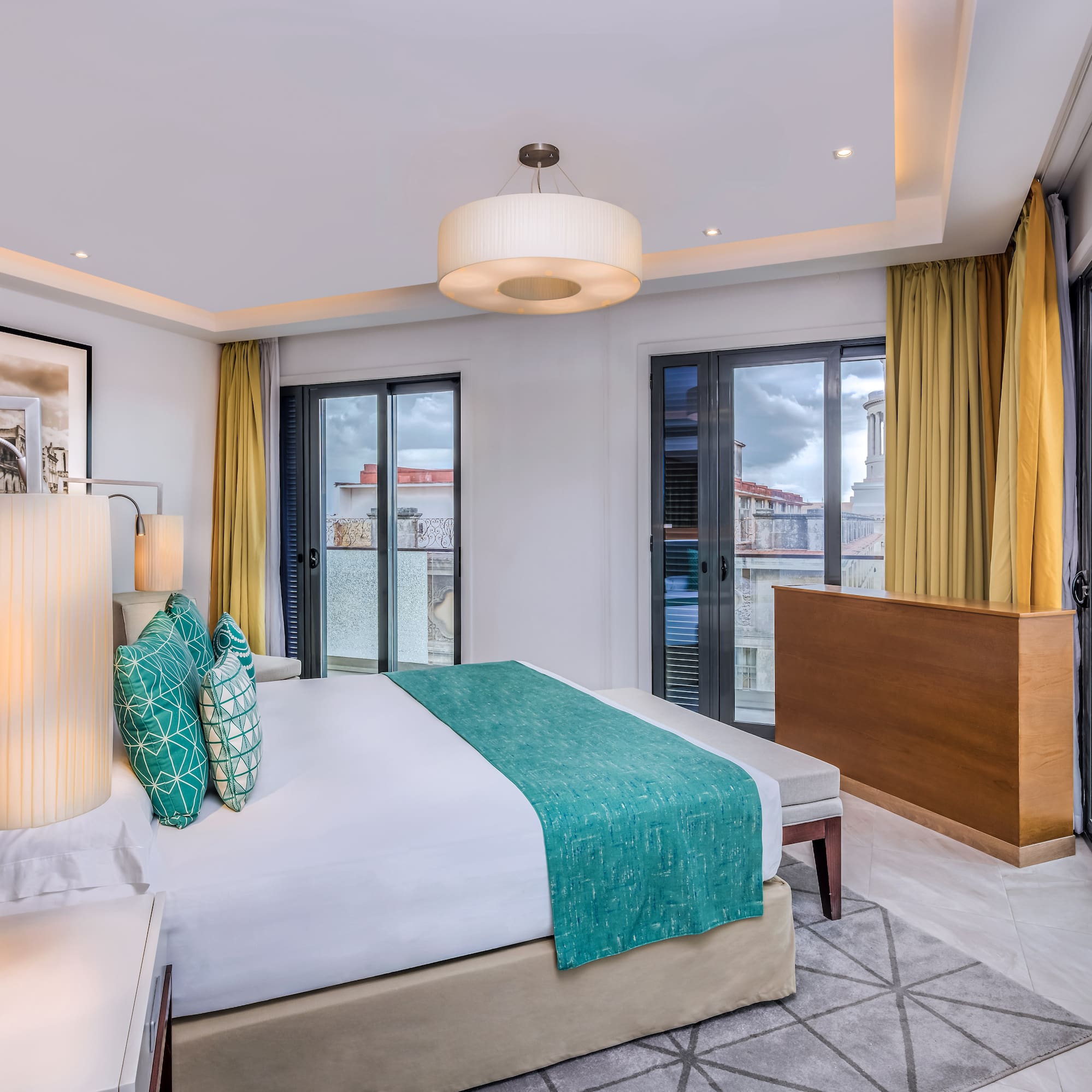 a bedroom with a bed and a lamp