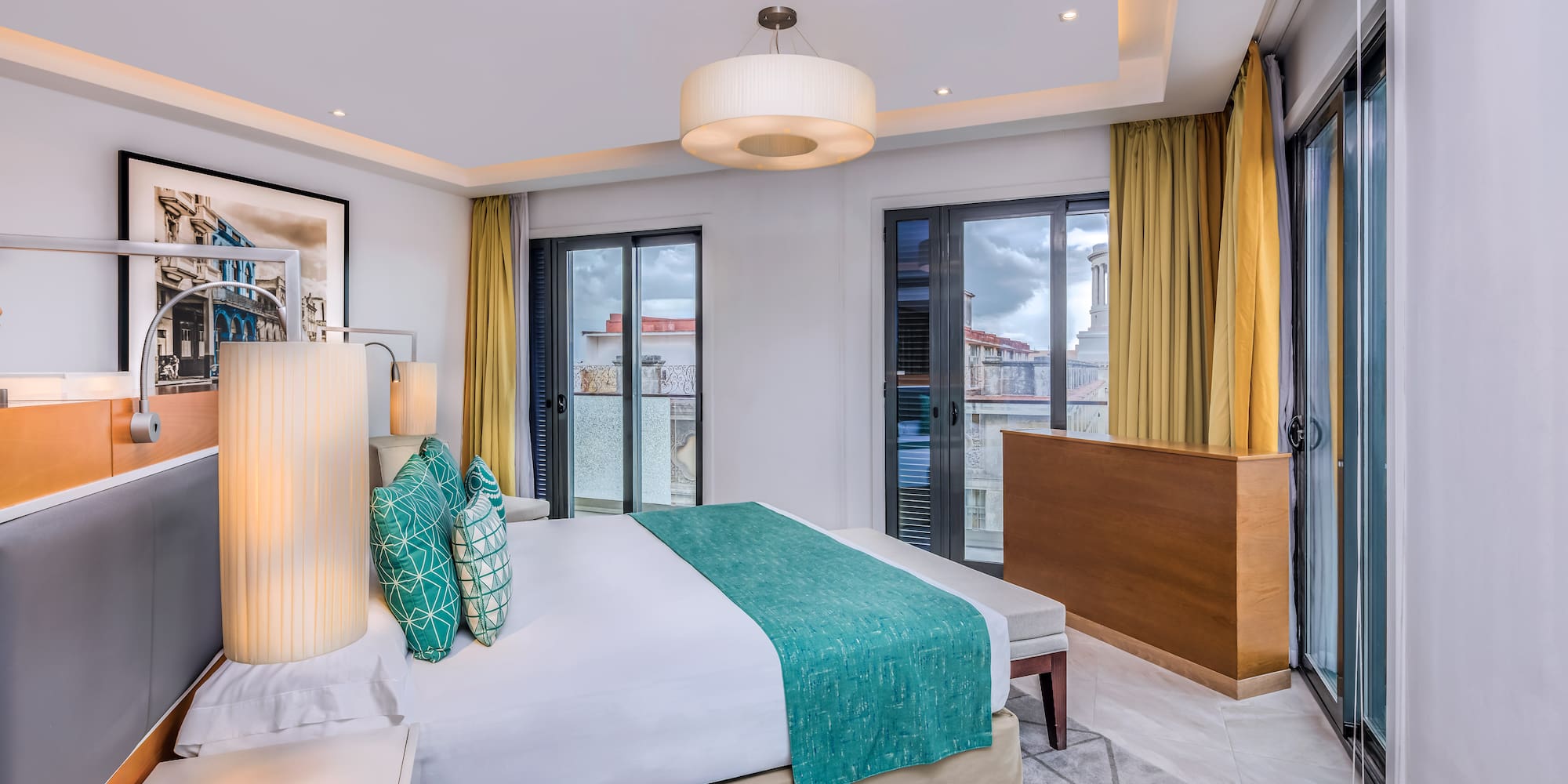 a bedroom with a bed and a lamp