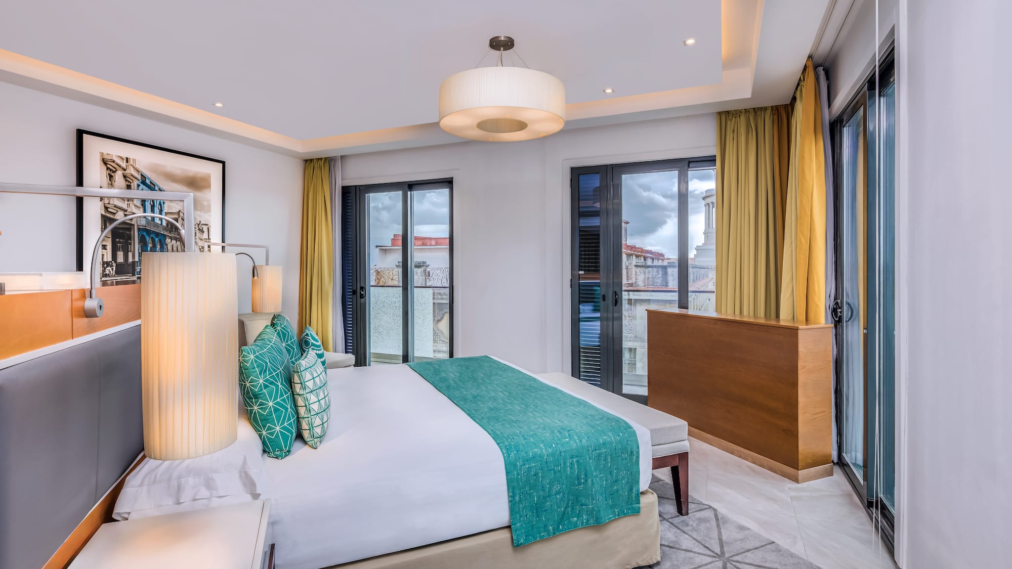 a bedroom with a bed and a lamp