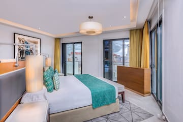 a bedroom with a bed and a lamp