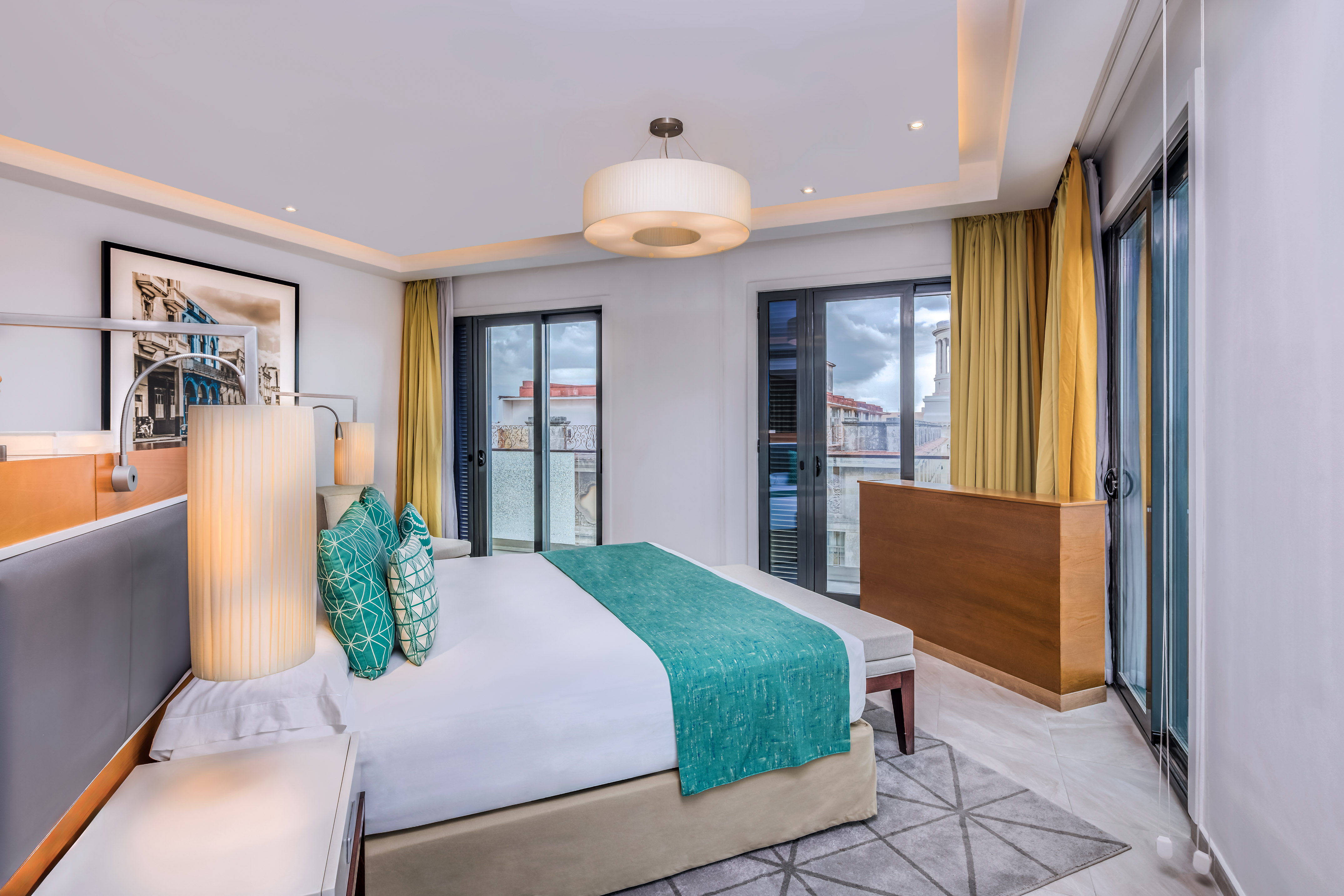 a bedroom with a bed and a lamp