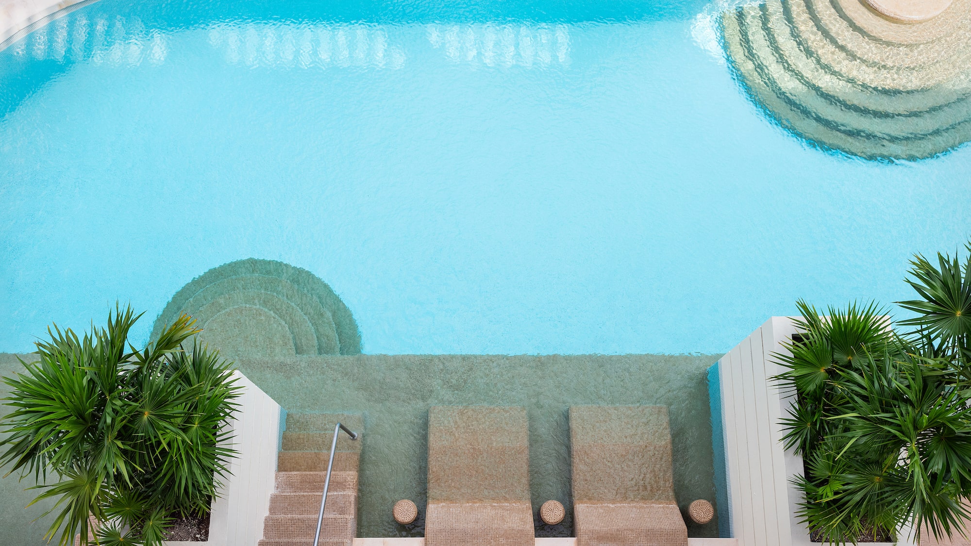 a swimming pool with steps and stairs