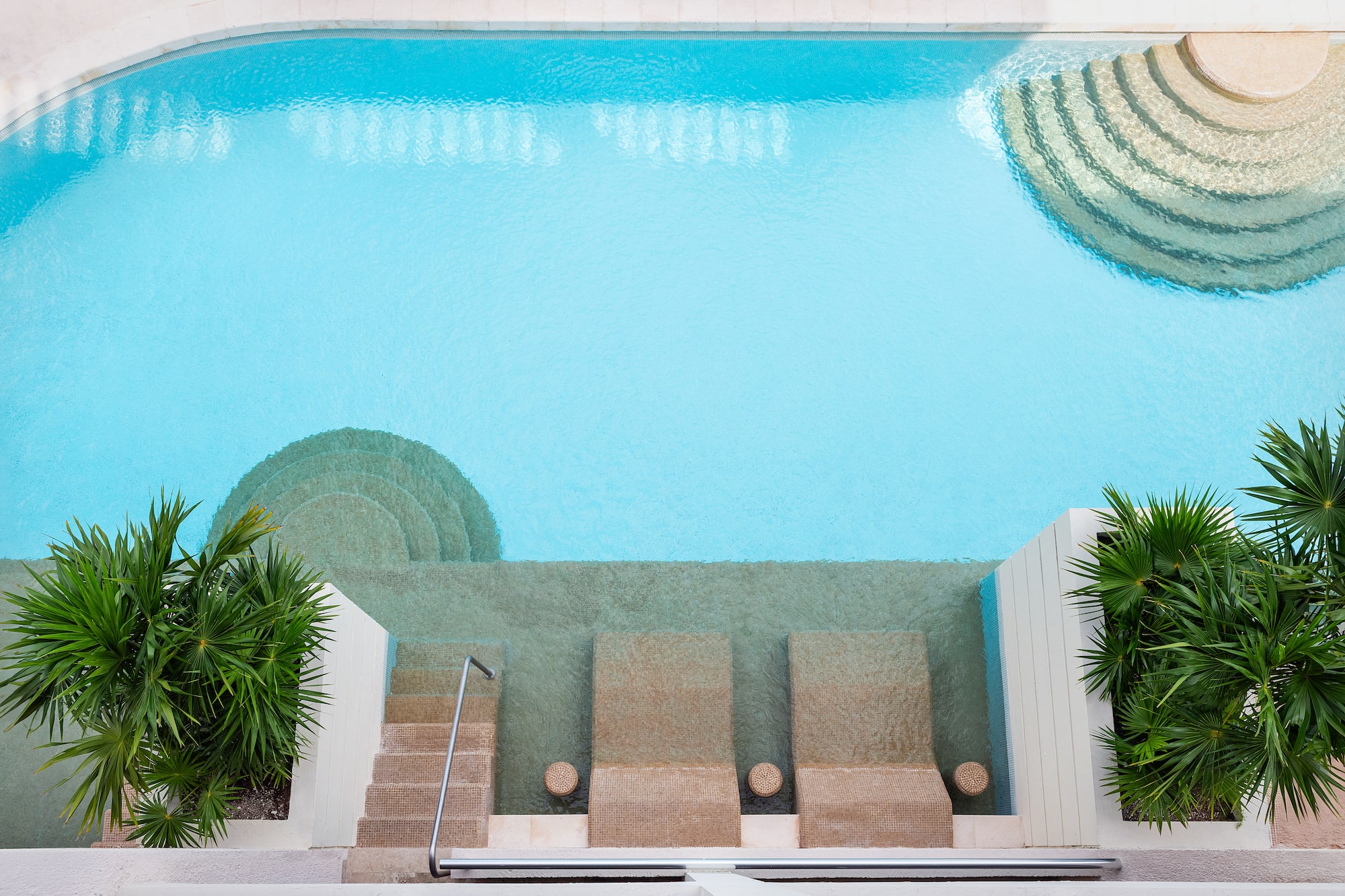 a swimming pool with steps and stairs