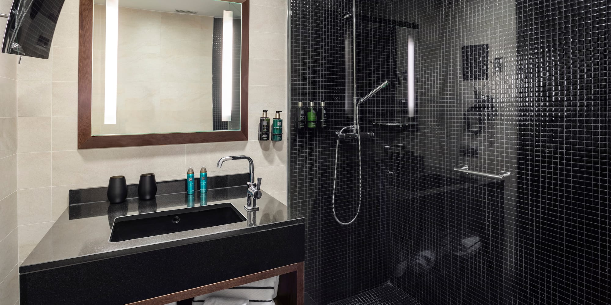 a bathroom with a shower and sink