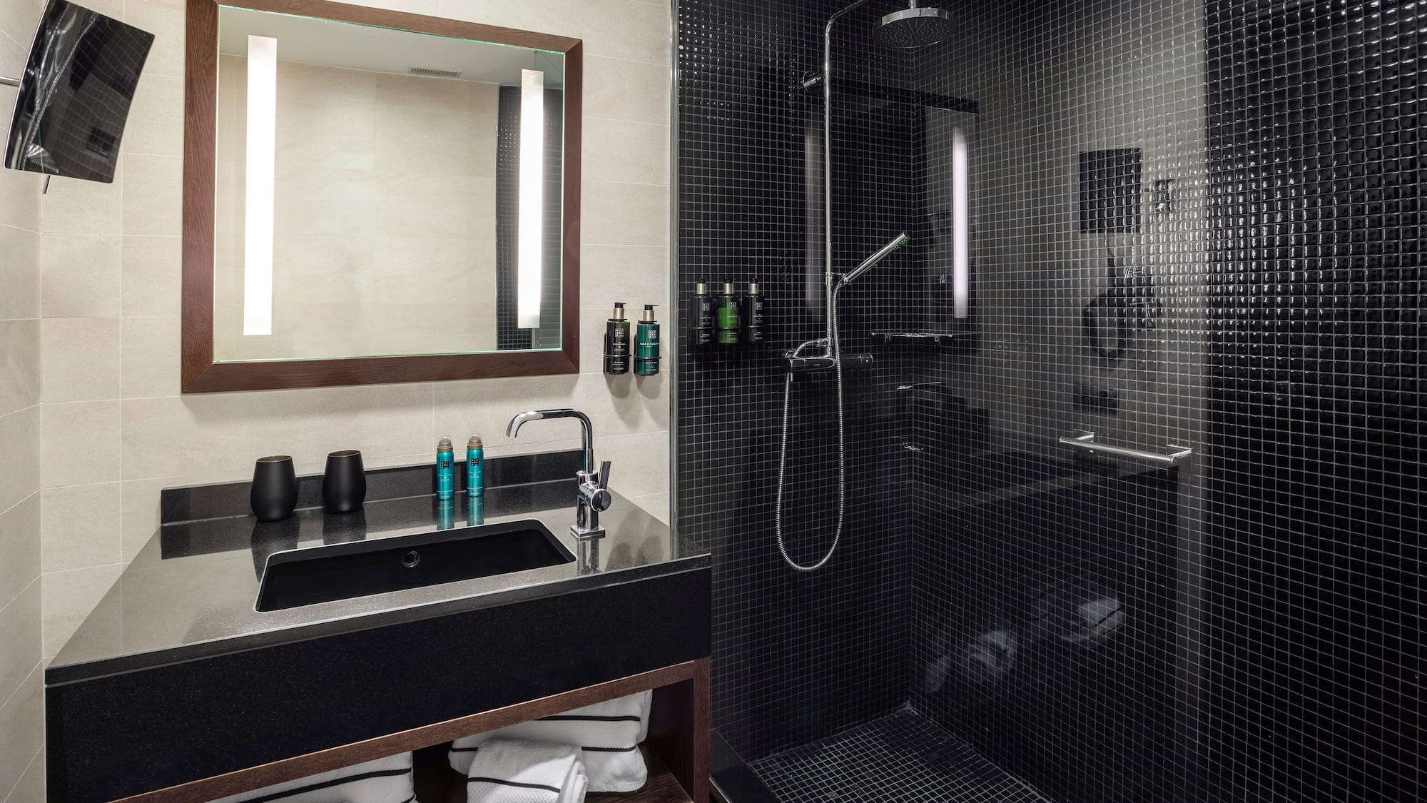 a bathroom with a shower and sink