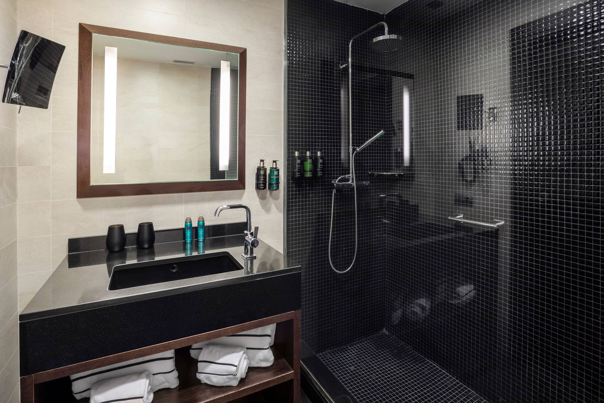 a bathroom with a shower and sink