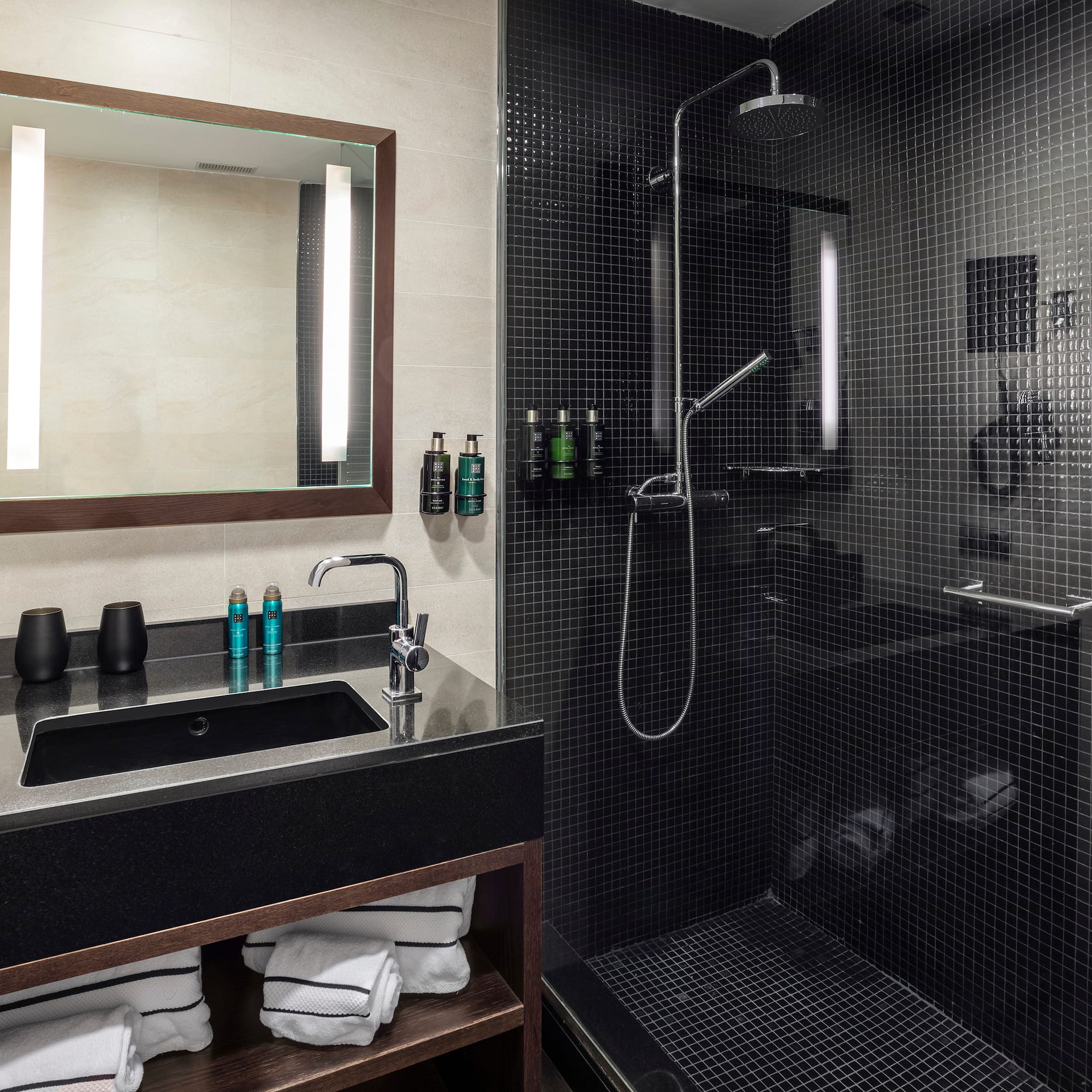 a bathroom with a shower and sink