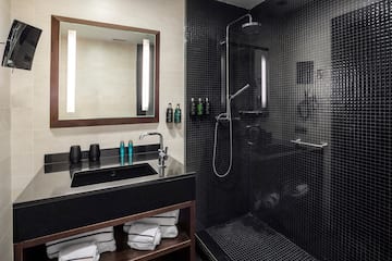 a bathroom with a shower and sink