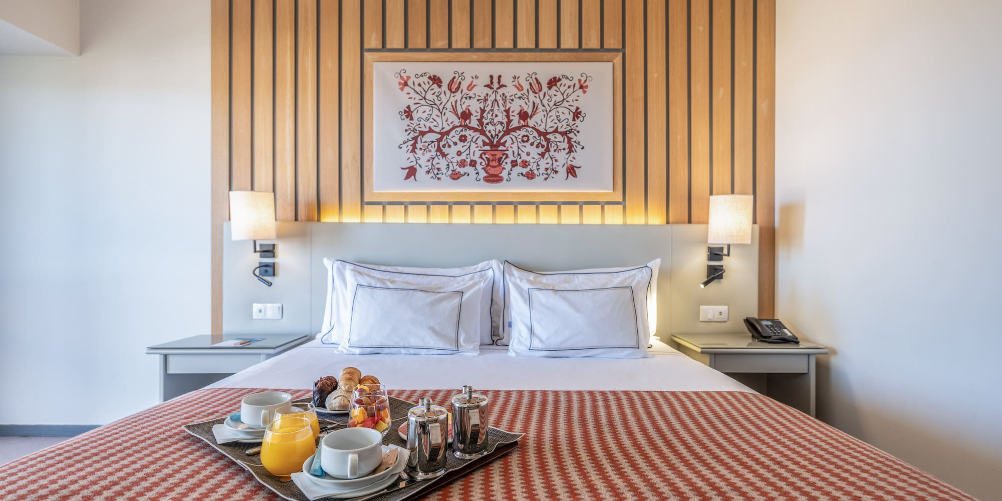 a tray of food on a bed