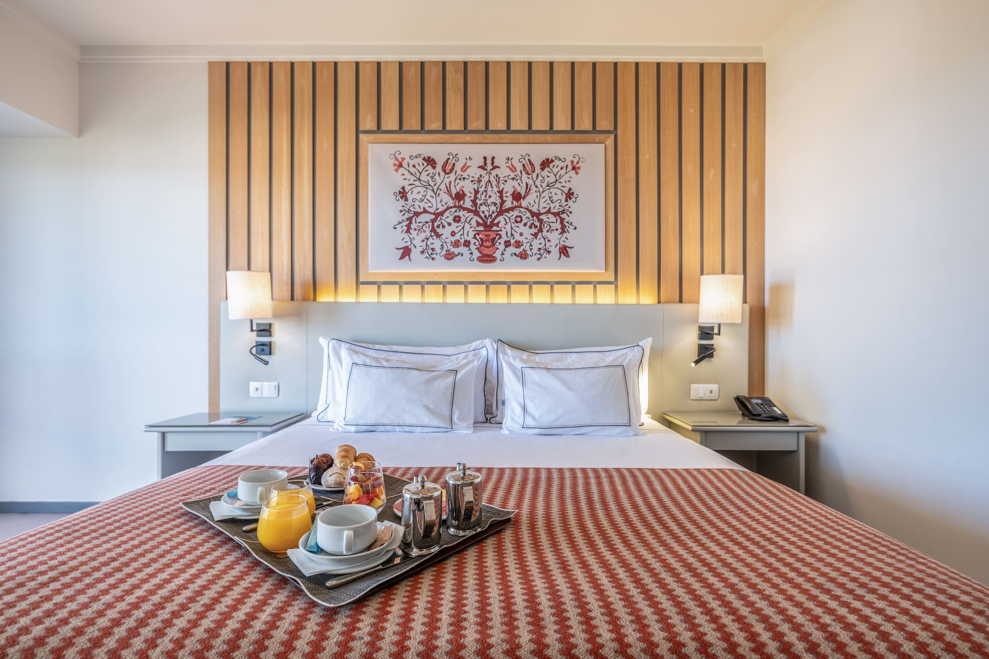 a tray of food on a bed