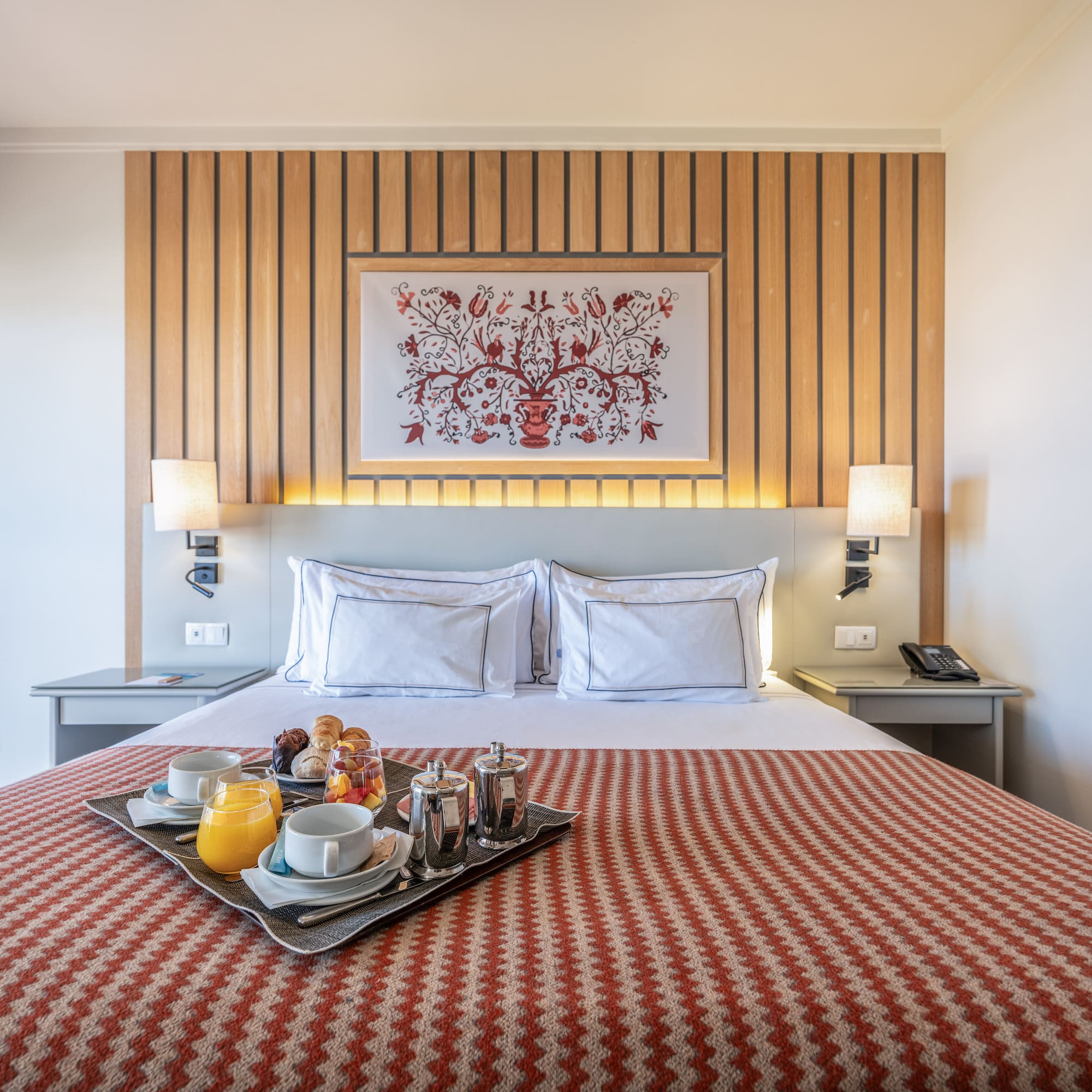 a tray of food on a bed