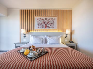 a tray of food on a bed