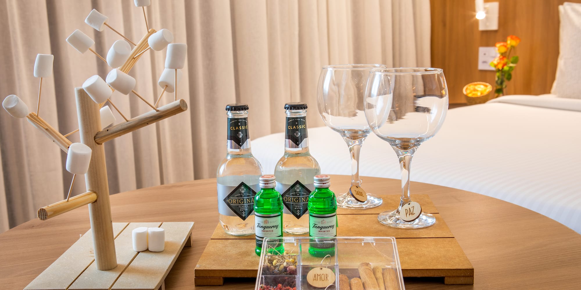a table with a variety of drinks and glasses