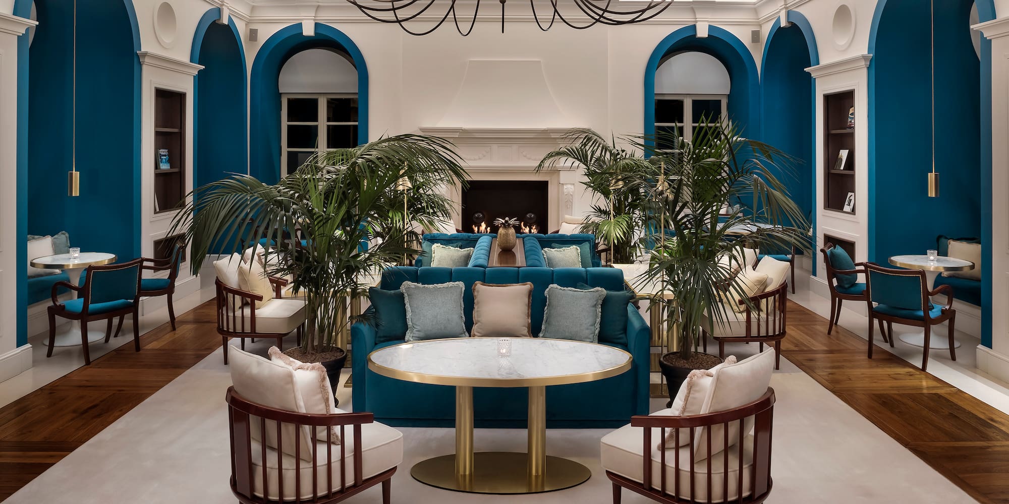 a room with a couch and chairs