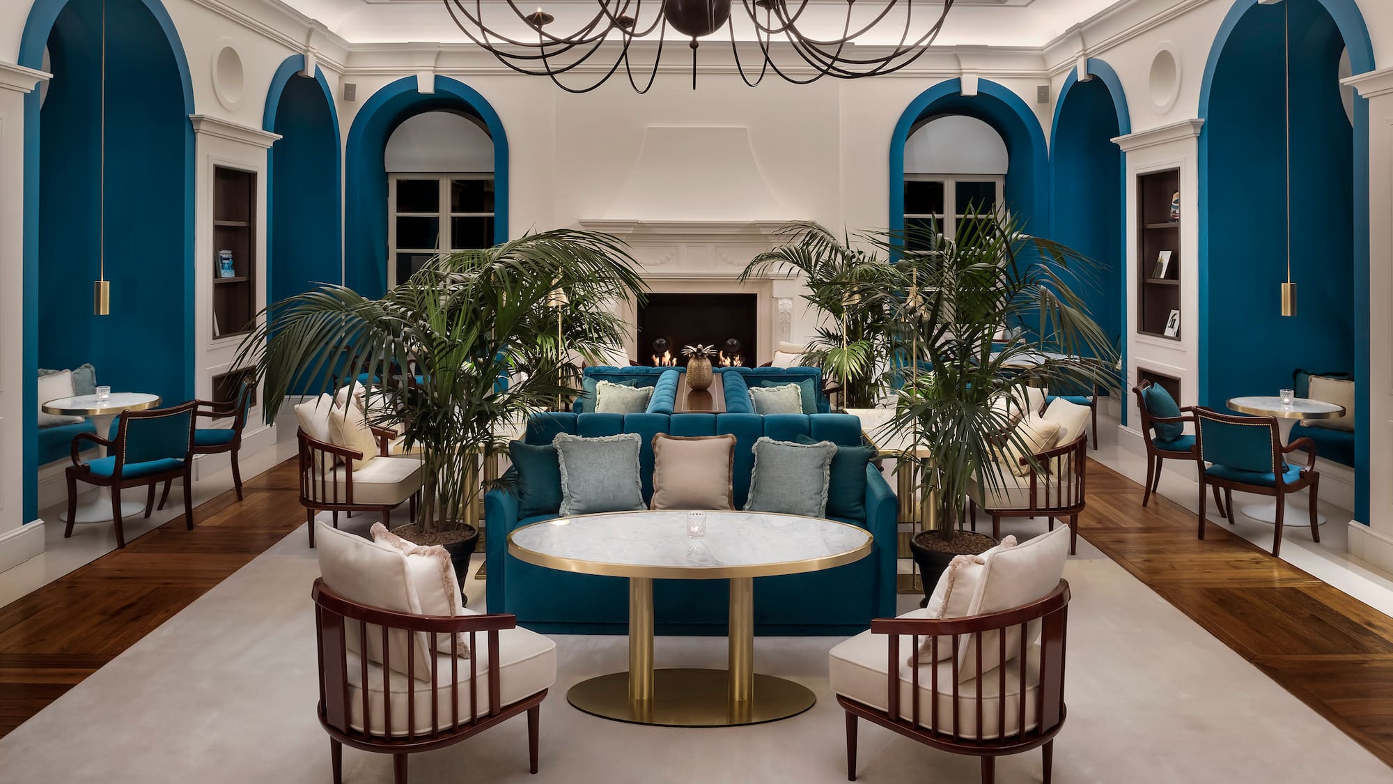 a room with a couch and chairs