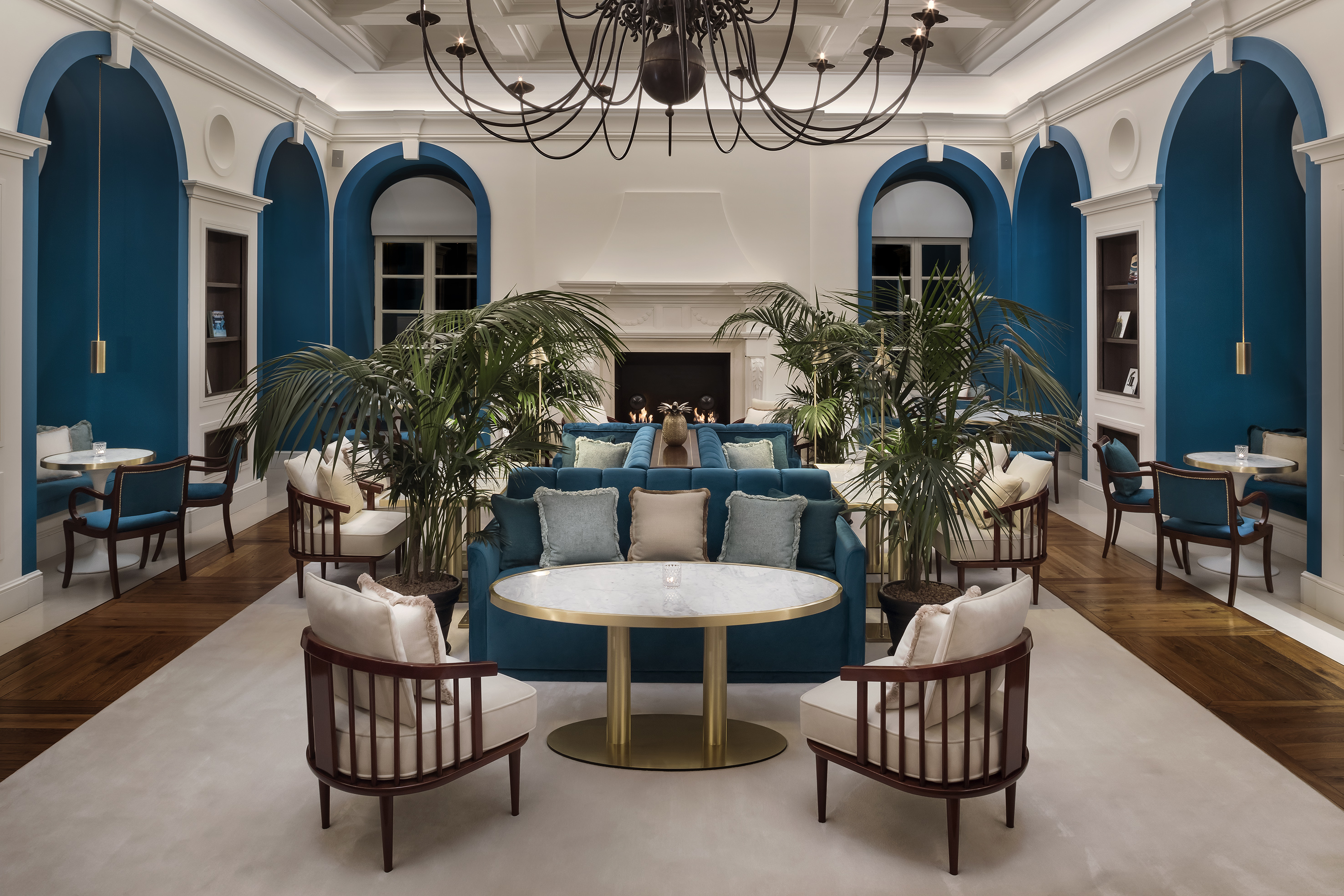 a room with a couch and chairs