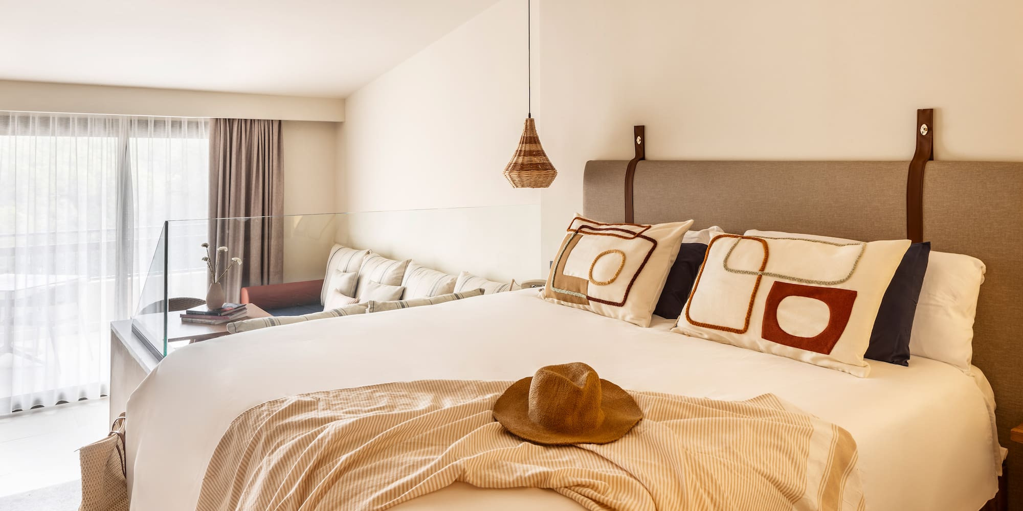 a bed with a hat on it