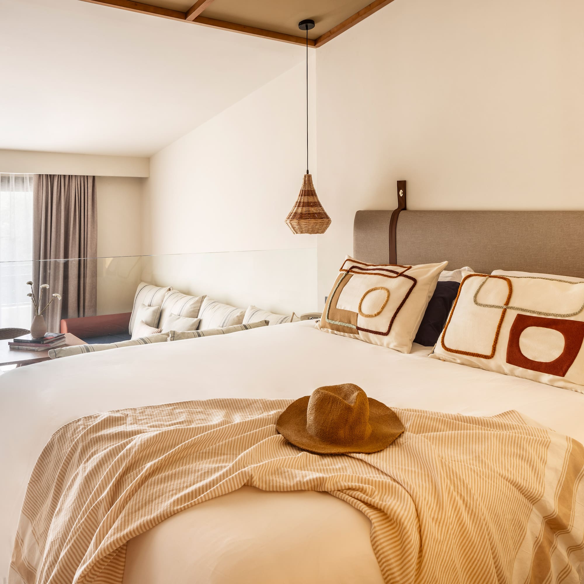 a bed with a hat on it