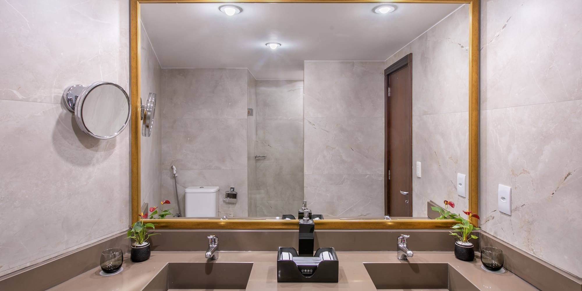 a bathroom with a large mirror and sinks