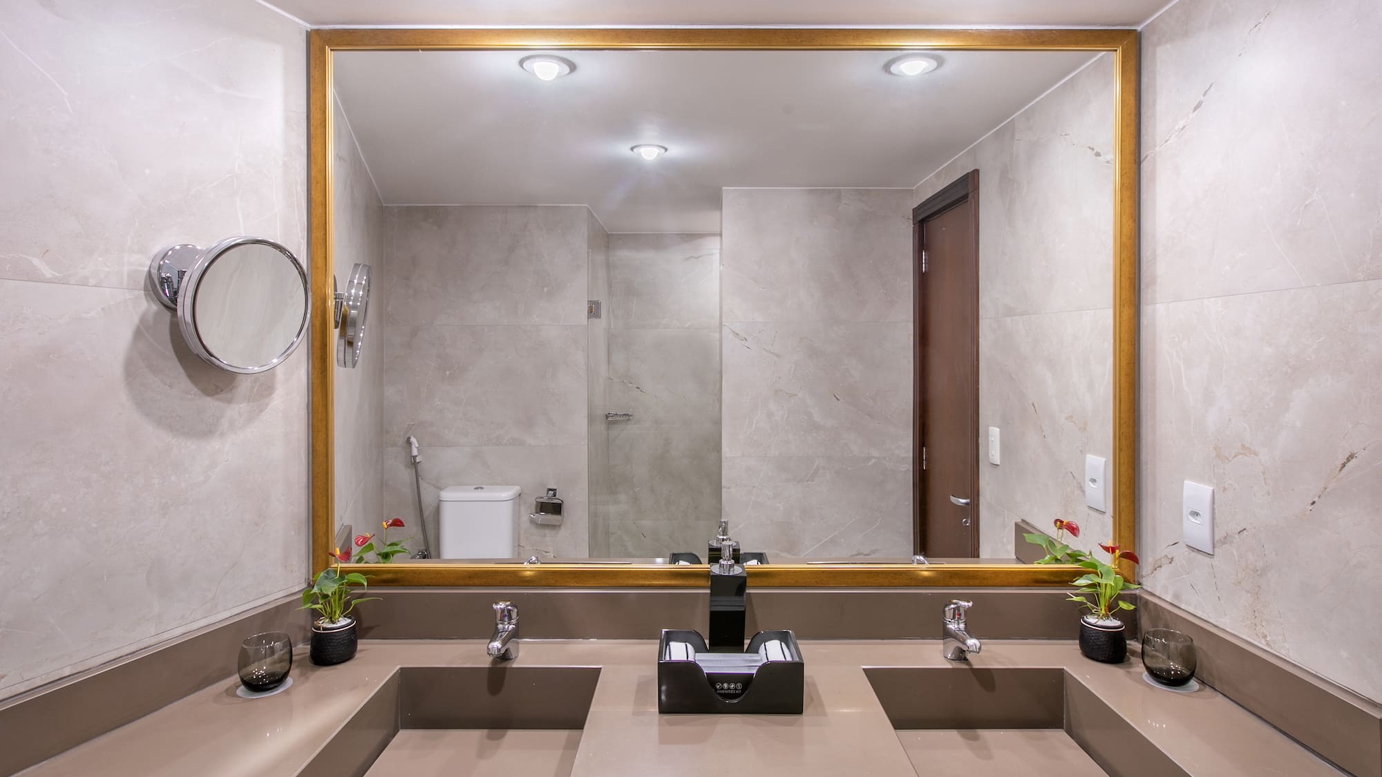 a bathroom with a large mirror and sinks