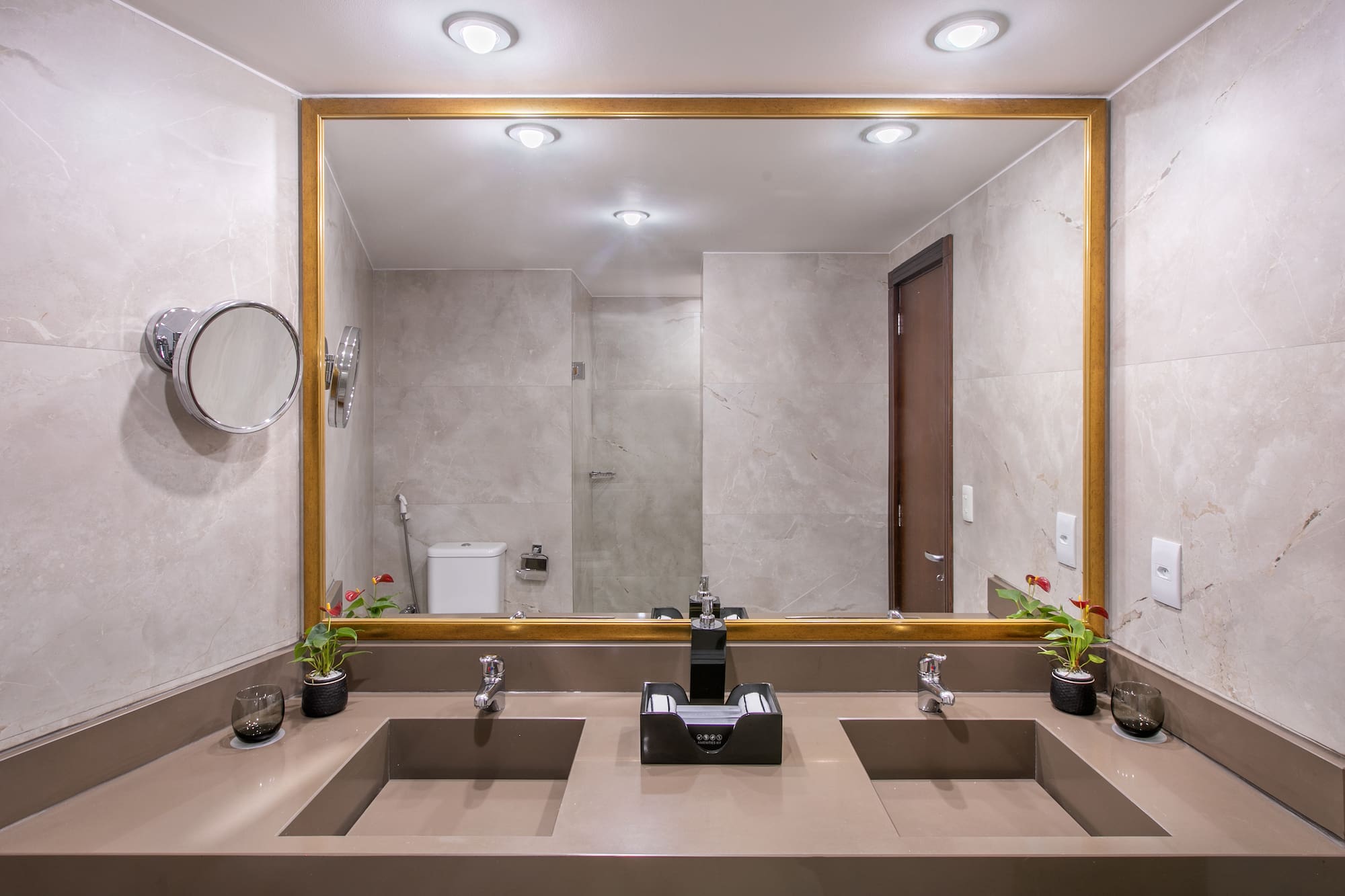 a bathroom with a large mirror and sinks