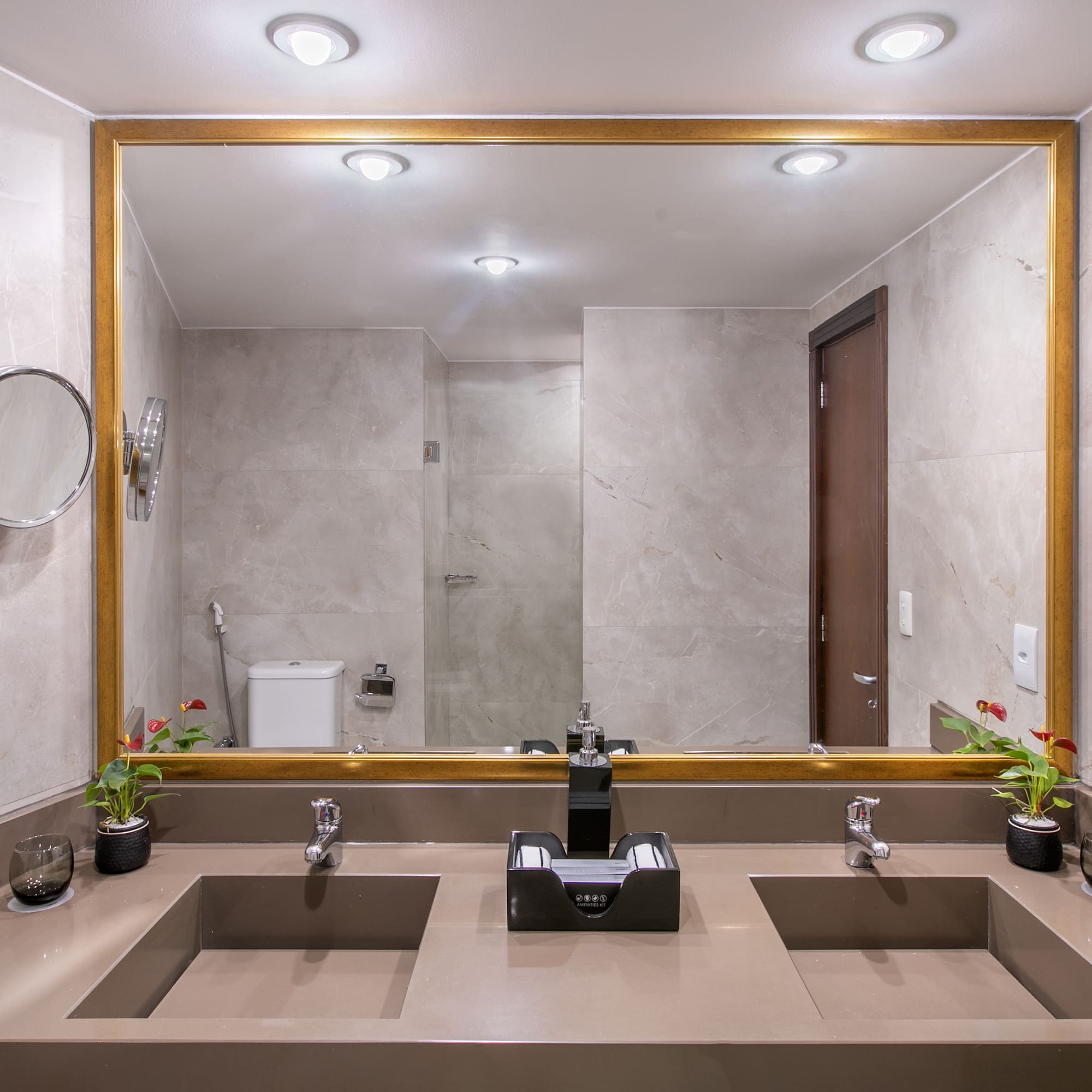 a bathroom with a large mirror and sinks