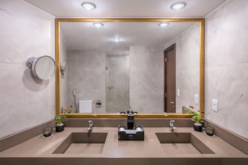 a bathroom with a large mirror and sinks