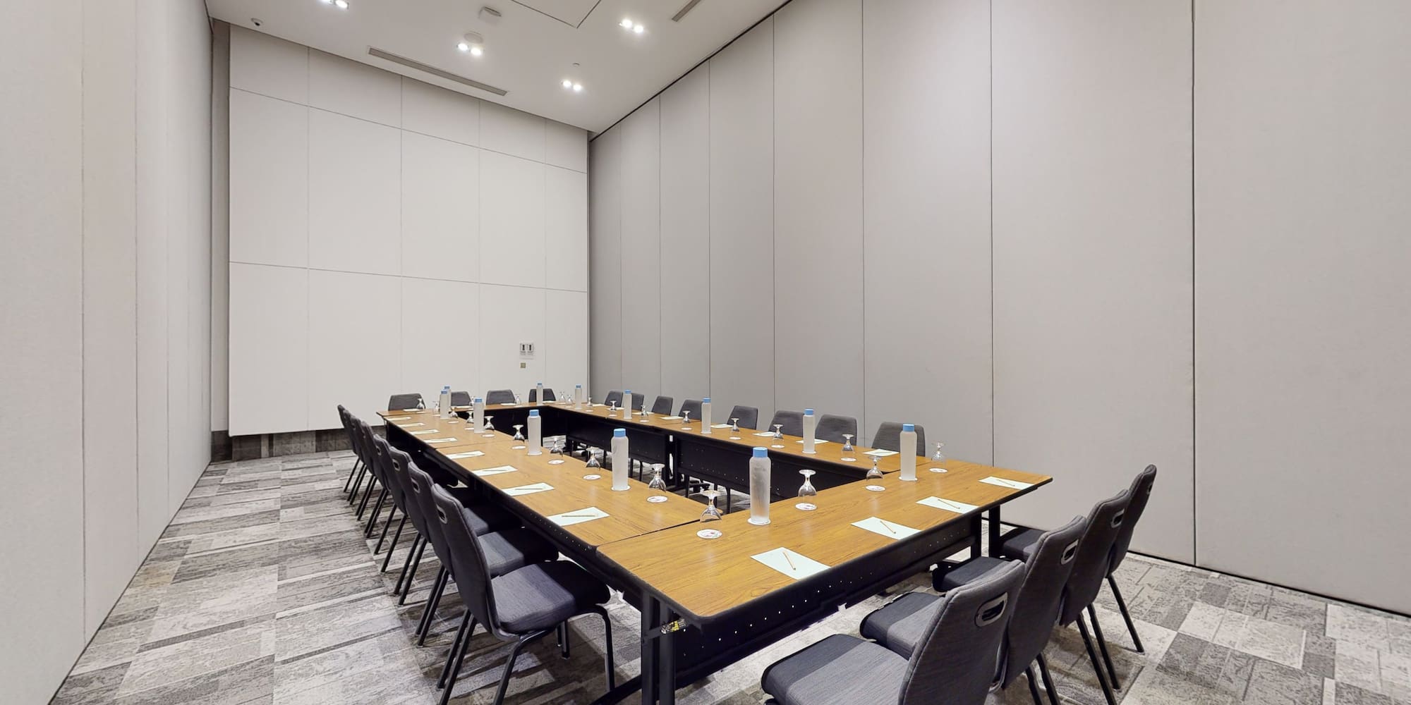 a long conference table with chairs