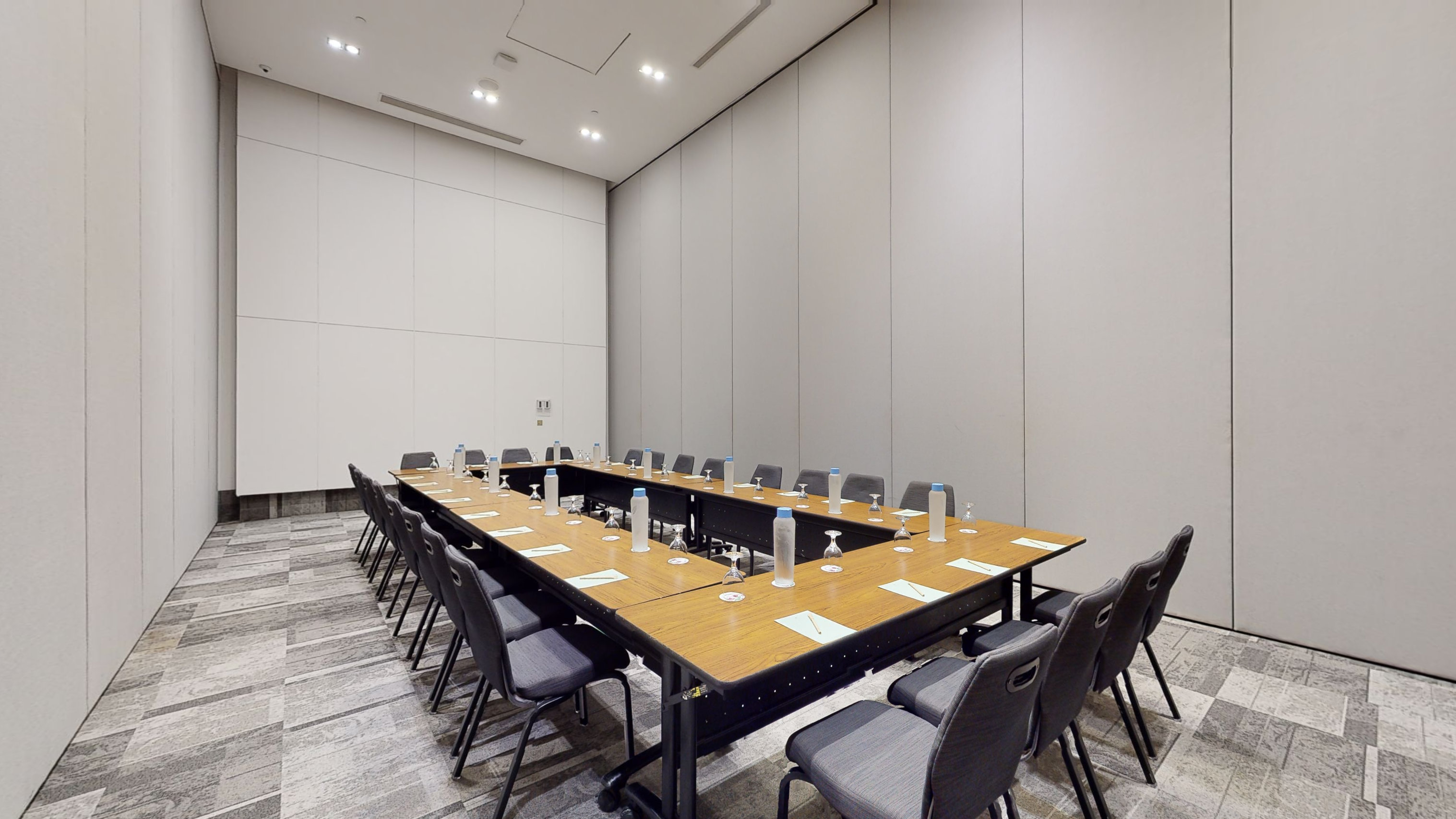 a long conference table with chairs