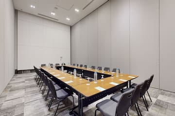 a long conference table with chairs