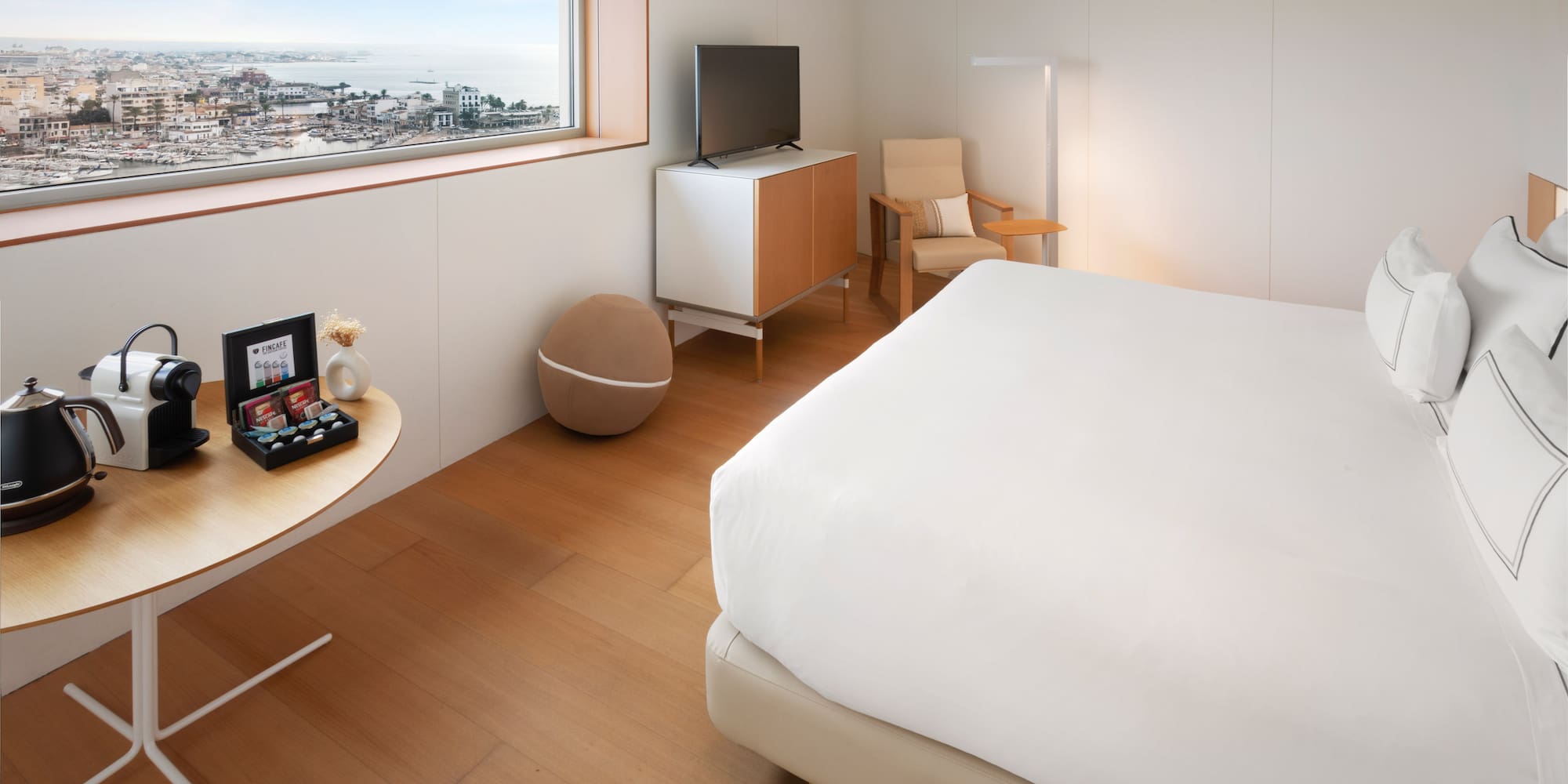 a bedroom with a bed and a television