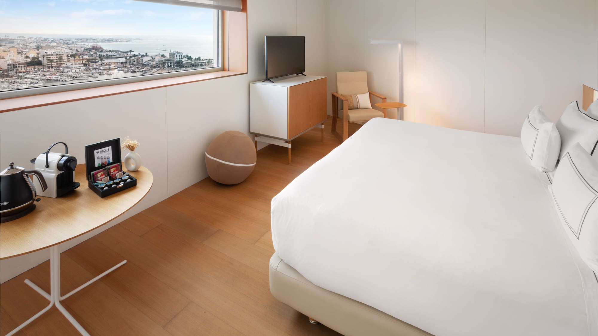 a bedroom with a bed and a television