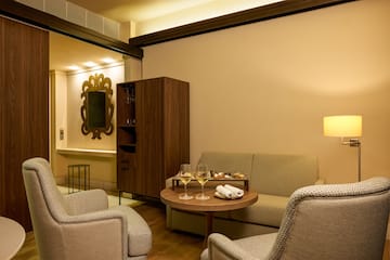 a room with a couch and a table with food on it