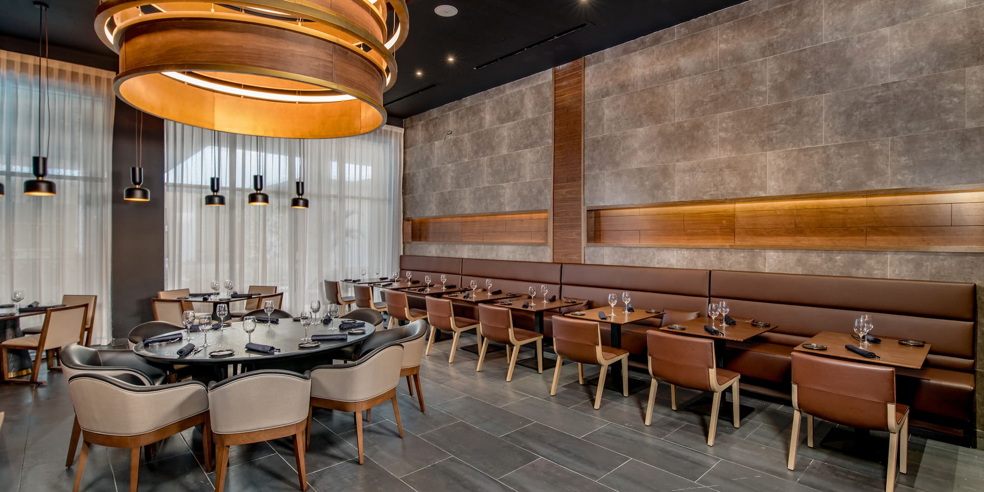 a room with a large table and chairs