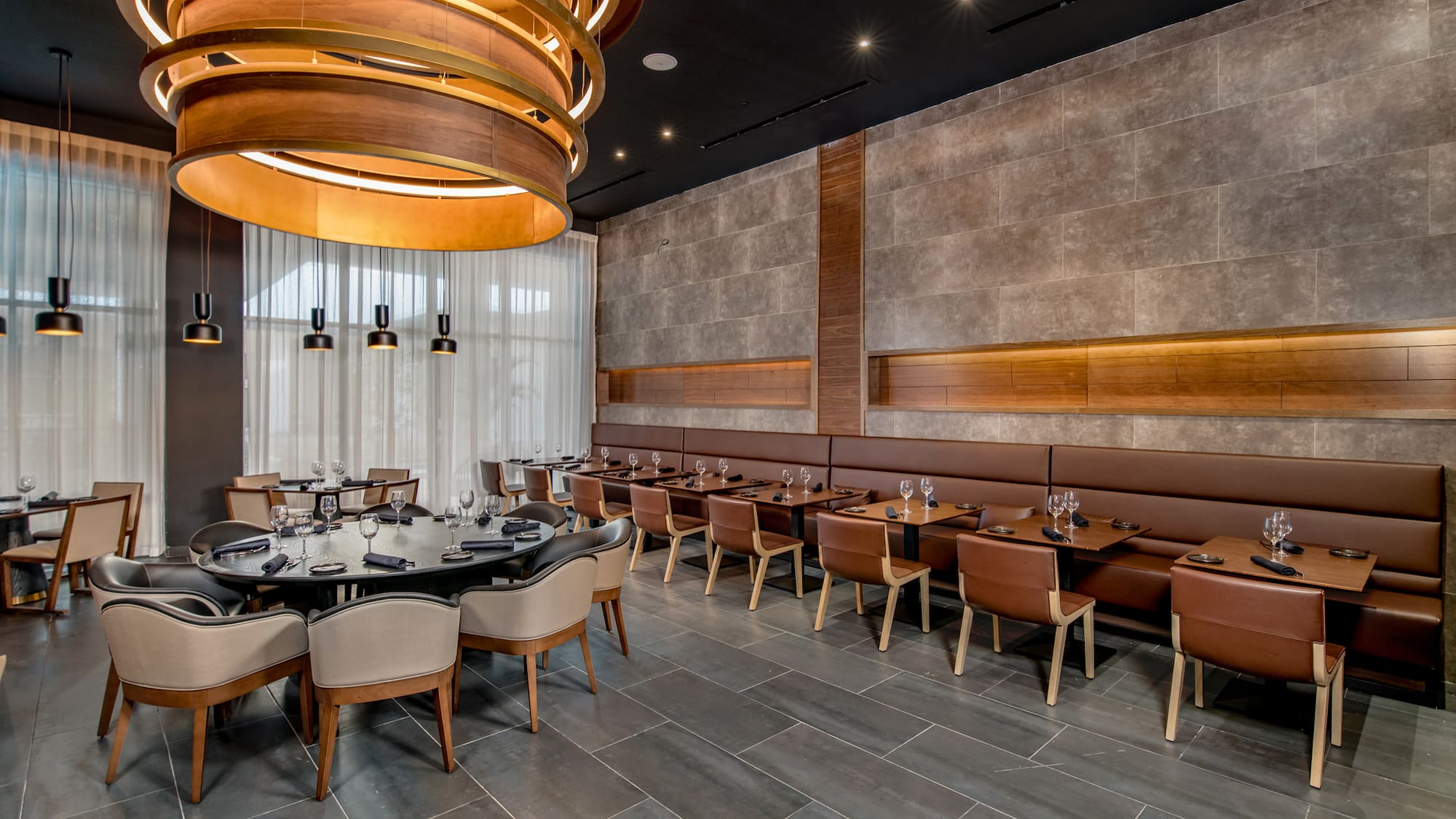 a room with a large table and chairs