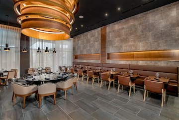 a room with a large table and chairs