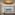 Upscale spa treatment room with two massage tables, window view, and golden ceiling.