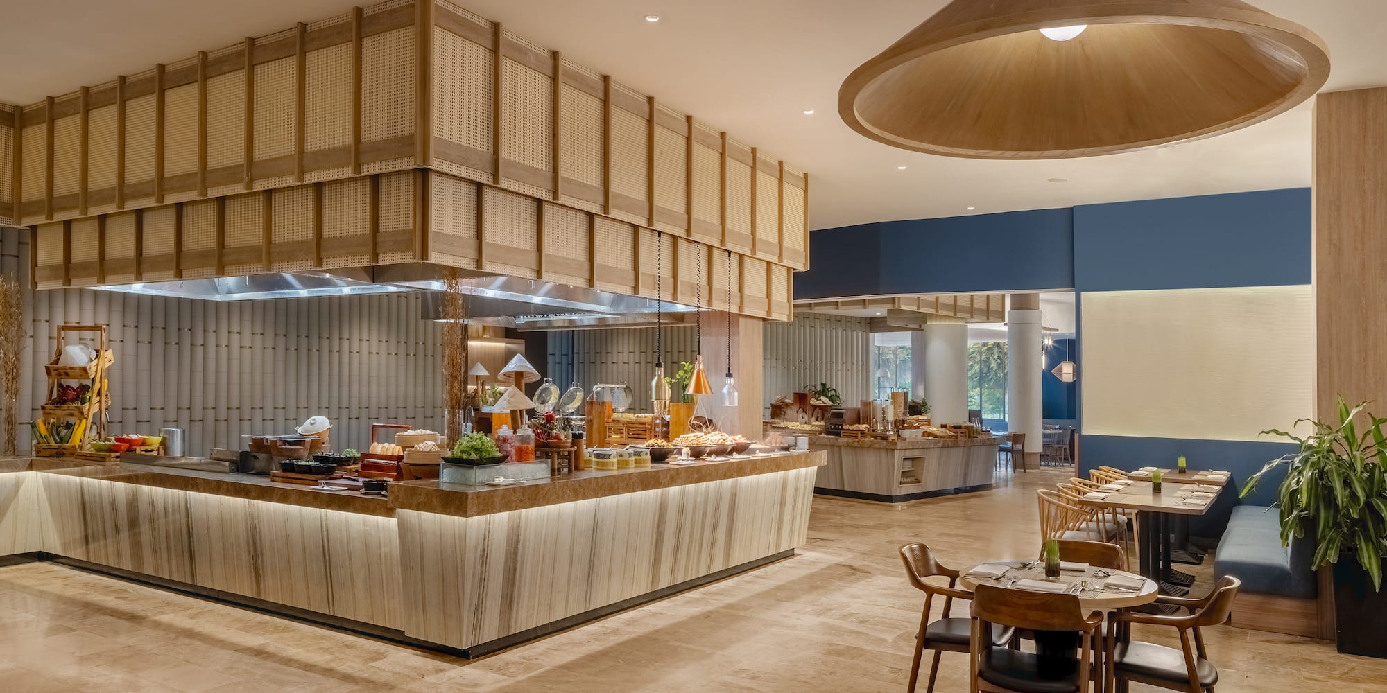 a restaurant with a buffet and a large chandelier